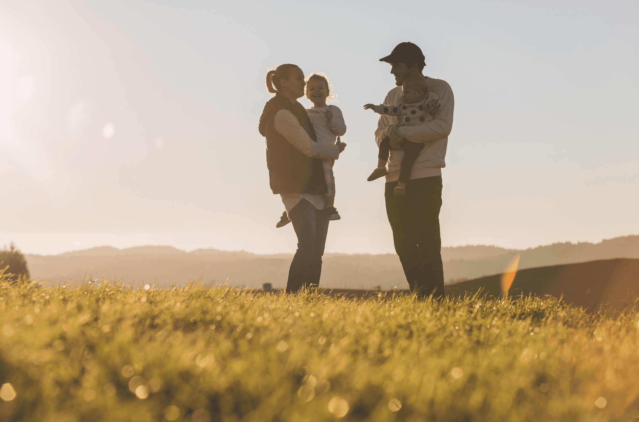 A family at sunset on the open land near Tokoroa