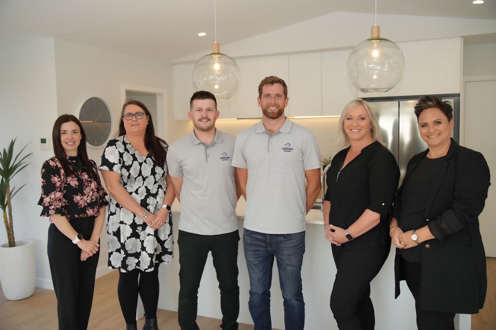 In the photo, from left to right, from Ultimate Builders are Robyn Spong, Toni Plasmeyer, Matt Crum, Ryan Motion, Karyn Lambert & Paula Wallace.